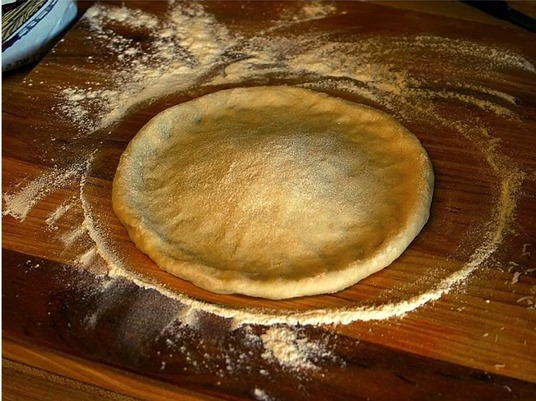 Hand stretched pizza dough